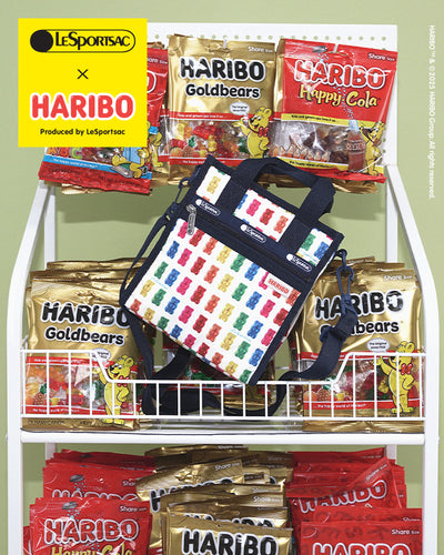 LeSportsac x HARIBO collaboration featuring a colorful gummy bear print bag displayed alongside various HARIBO candy bags, including Goldbears and Happy Cola.