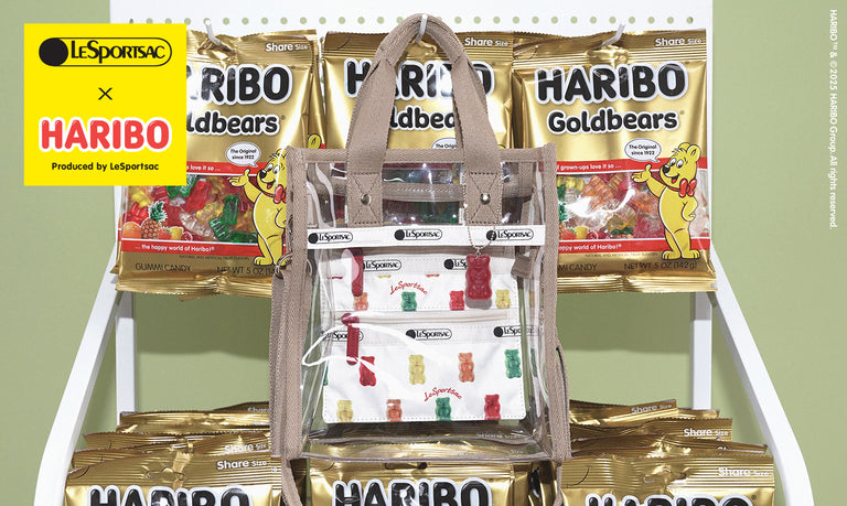 LeSportsac x Haribo collaboration showcasing a transparent handbag with gummy bear prints, positioned in front of packs of Haribo Goldbears.